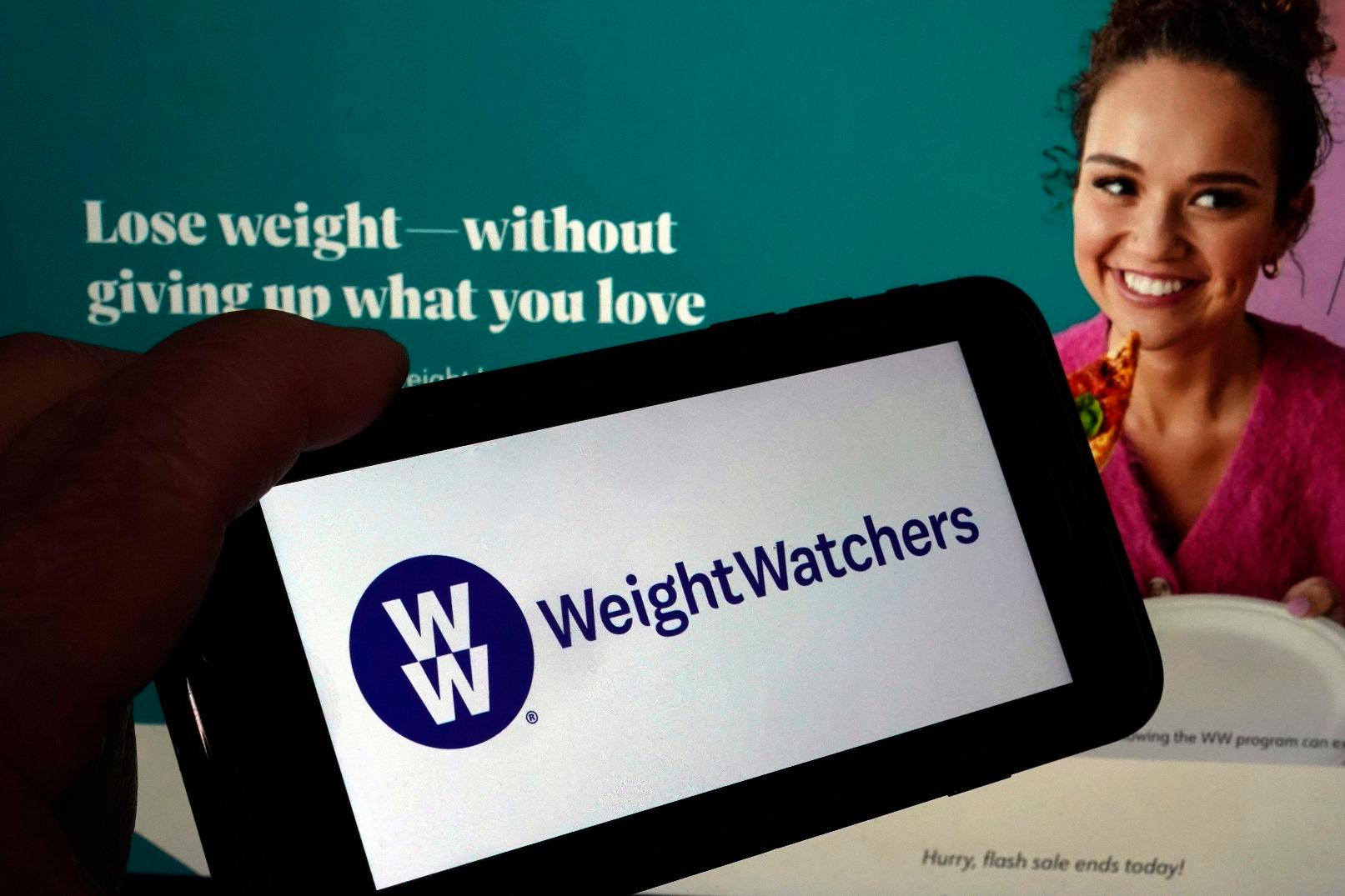 FILE - This image shows the logo of WeightWatchers on a mobile phone, and the company's website, in New York, March 7, 2023. (AP Photo/Richard Drew, File)